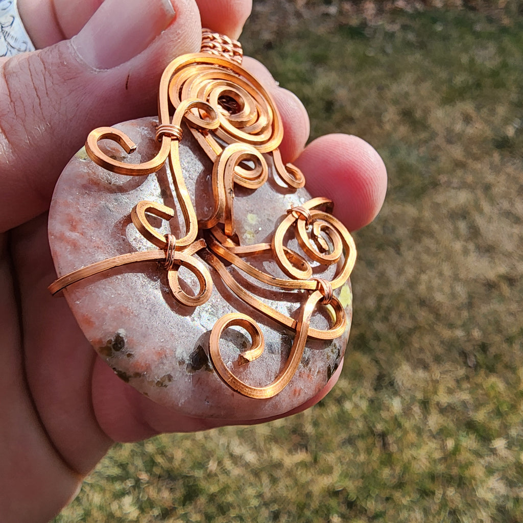 Pink Granite Doughnut Medallion Wrapped in Copper